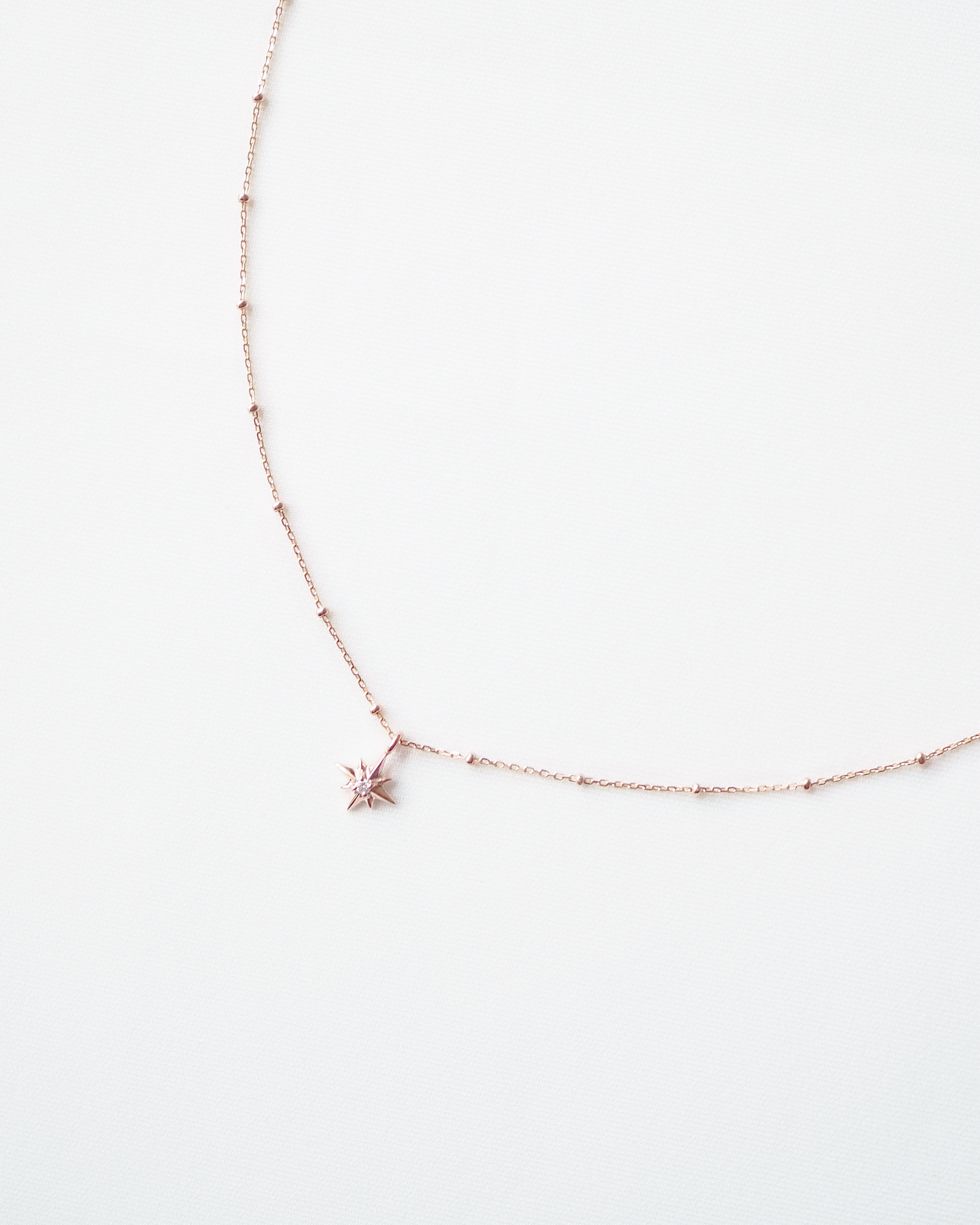 Gold star necklace with diamonds best sale